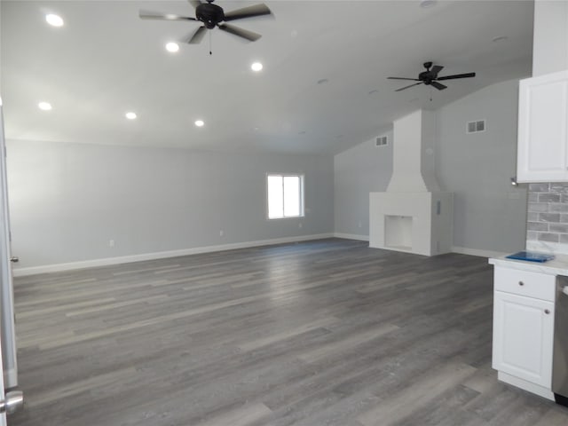 unfurnished living room featuring ceiling fan, lofted ceiling, and wood-type flooring