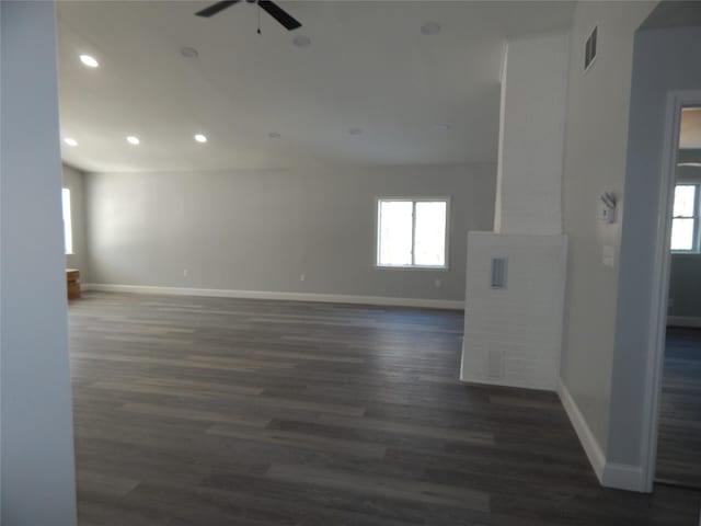 unfurnished room featuring dark hardwood / wood-style floors and ceiling fan