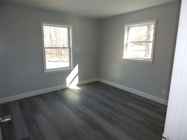 empty room featuring dark wood-type flooring