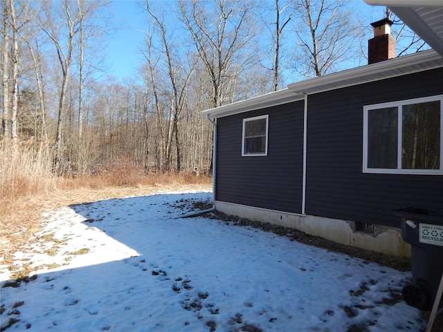 view of yard covered in snow