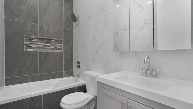 full bath featuring tile walls, backsplash, toilet, tiled shower / bath combo, and vanity