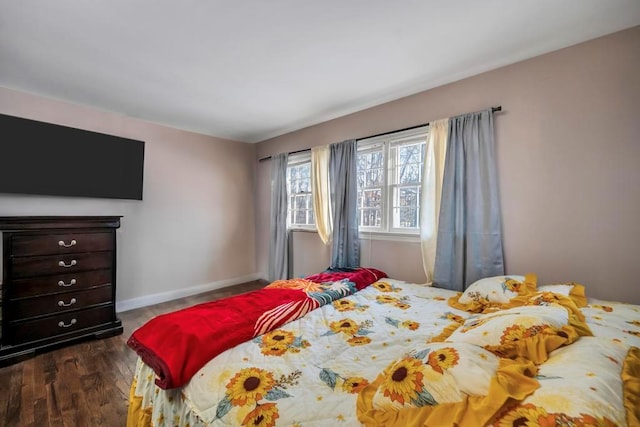 bedroom with dark wood-type flooring