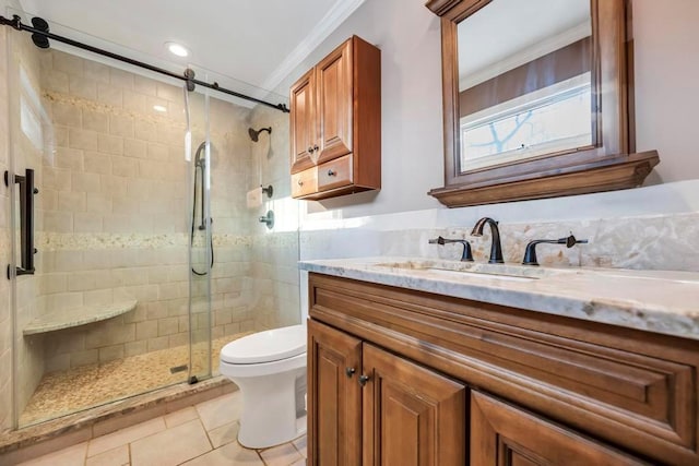 bathroom with crown molding, a shower with door, tile patterned flooring, vanity, and toilet