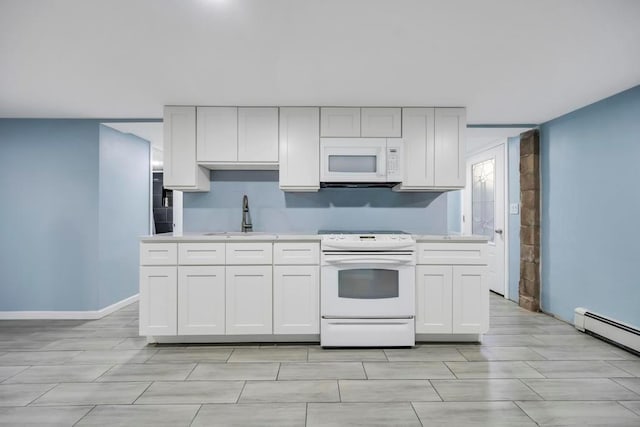 kitchen featuring white appliances, a baseboard radiator, sink, and white cabinets