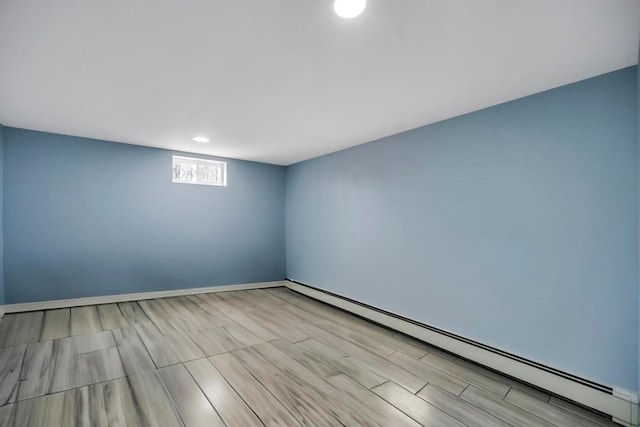 empty room featuring baseboard heating