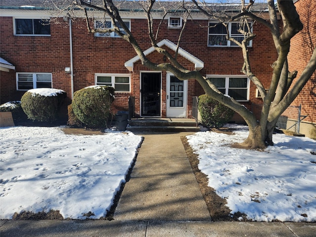 view of snow covered property entrance