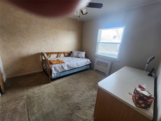 bedroom with radiator, ceiling fan, and carpet flooring