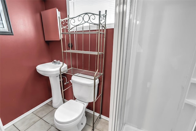 bathroom with tile patterned flooring and toilet