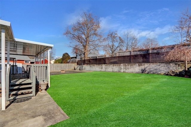 view of yard featuring a deck