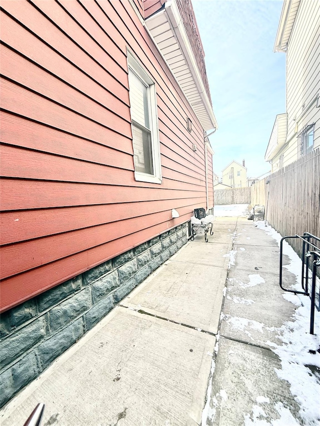 view of side of property with a patio