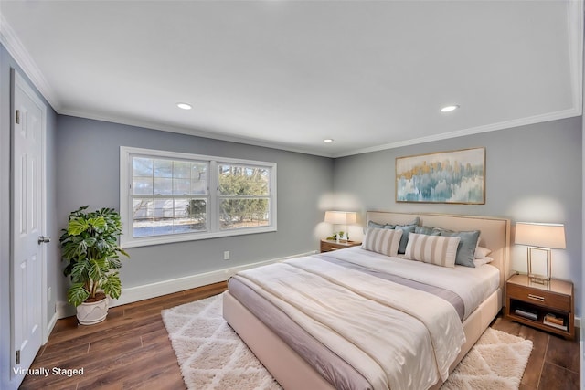 bedroom with dark hardwood / wood-style flooring and crown molding