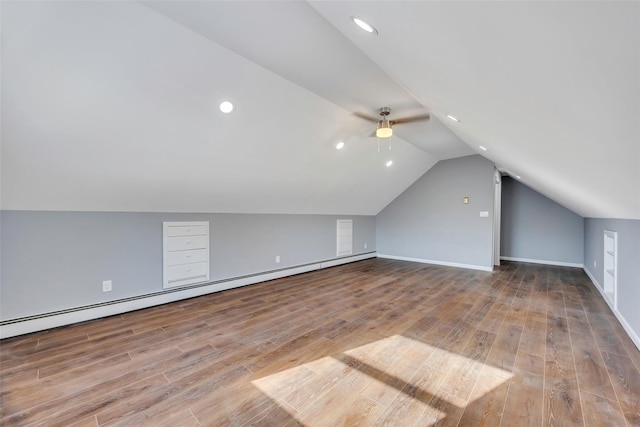 bonus room with hardwood / wood-style flooring, vaulted ceiling, ceiling fan, and baseboard heating