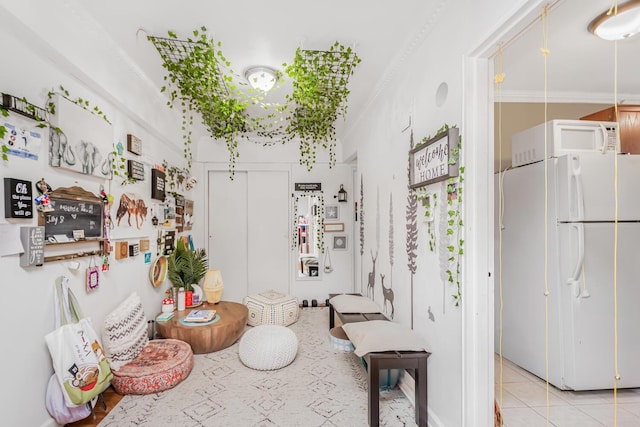 bathroom with crown molding and tile patterned floors