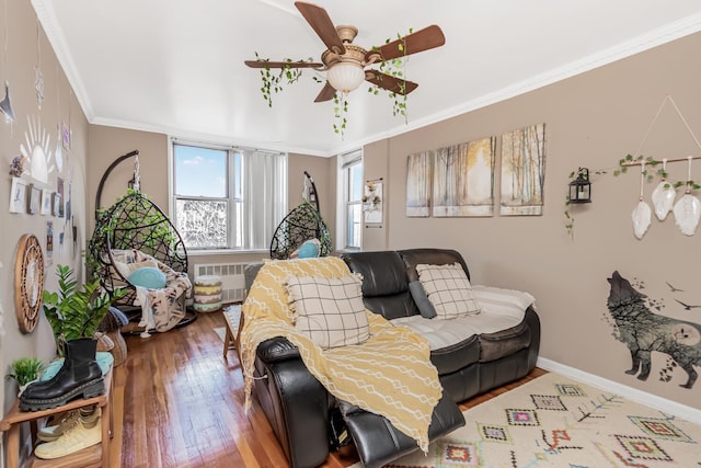 living room featuring crown molding, radiator, hardwood / wood-style floors, and ceiling fan