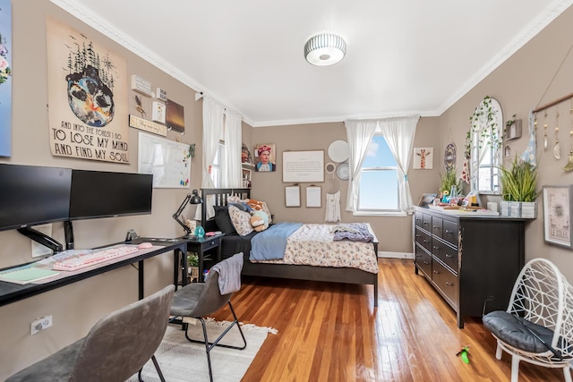 bedroom featuring crown molding and hardwood / wood-style flooring