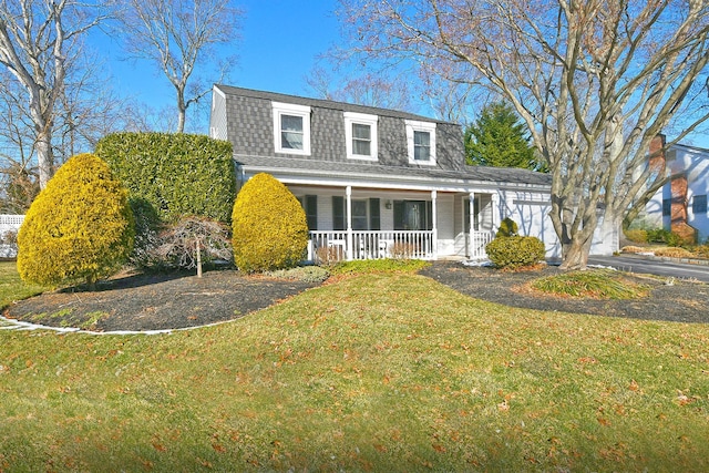 front of property with covered porch and a front lawn