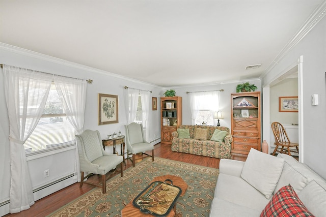 living room with baseboard heating, ornamental molding, and wood-type flooring