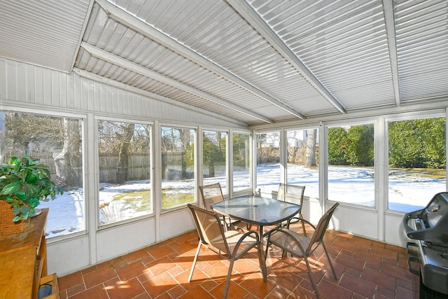 sunroom / solarium with vaulted ceiling and a wealth of natural light