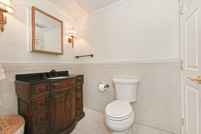 bathroom featuring tile walls, vanity, ornamental molding, and tile patterned floors