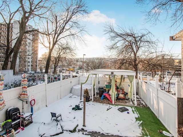 view of yard layered in snow