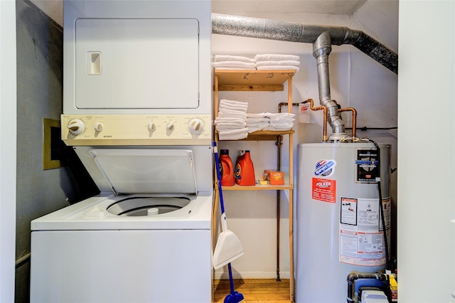 washroom featuring stacked washing maching and dryer, light wood-type flooring, and gas water heater