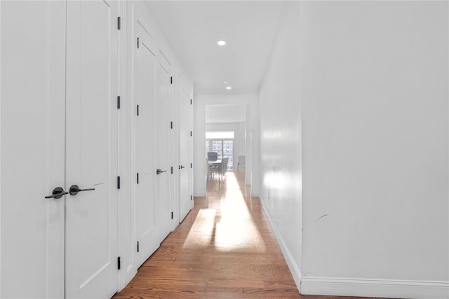 hallway featuring wood-type flooring