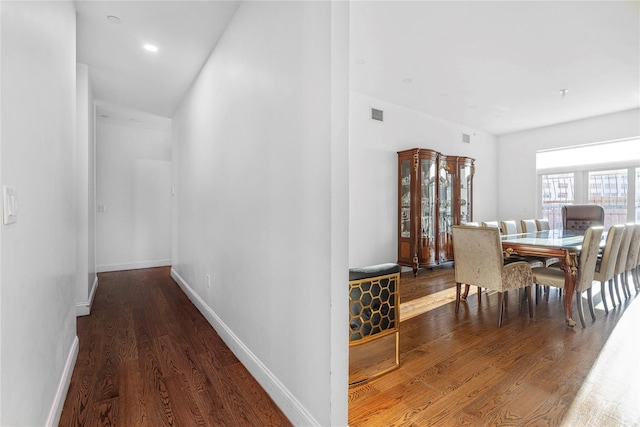 hallway with wood-type flooring