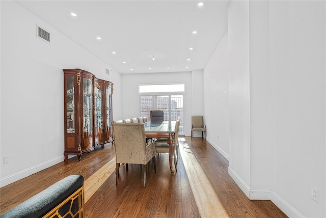 dining space featuring wood-type flooring