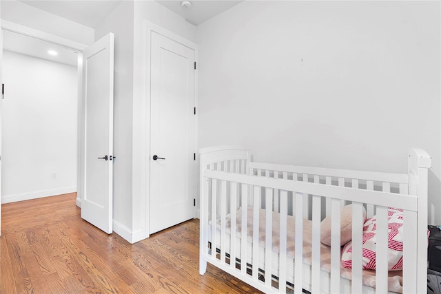 bedroom with hardwood / wood-style flooring