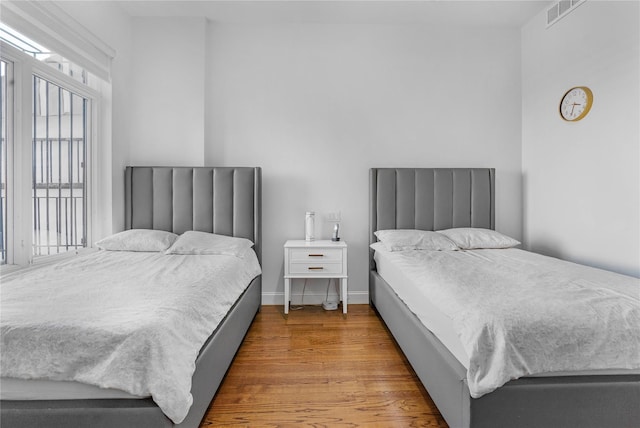 bedroom with hardwood / wood-style floors