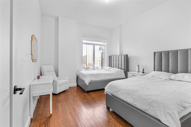 bedroom featuring wood-type flooring