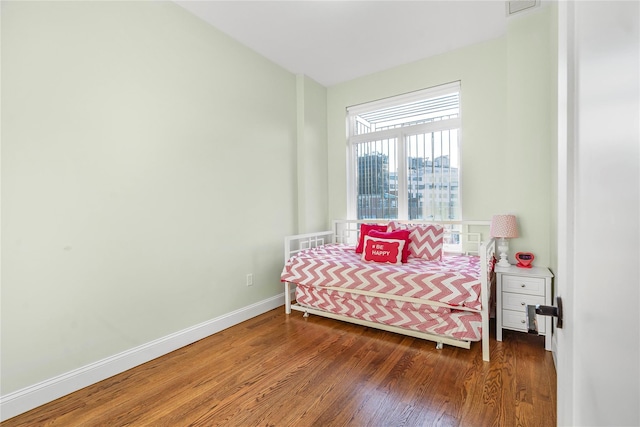 bedroom featuring dark wood-type flooring