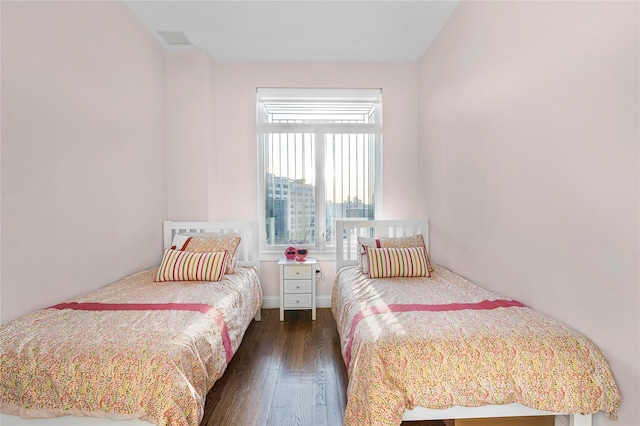 bedroom featuring dark wood-type flooring