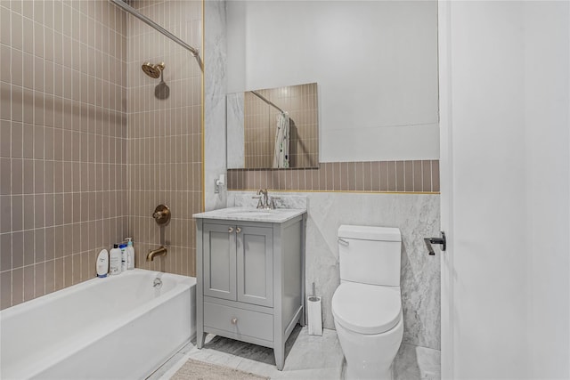 full bathroom with vanity, tile walls, toilet, and shower / bathtub combination with curtain