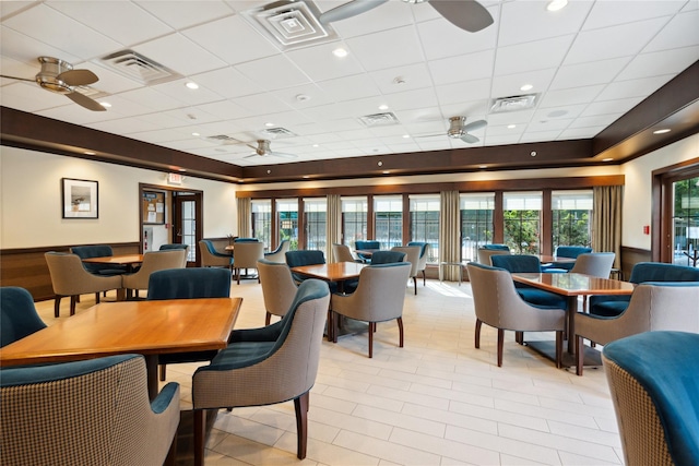 dining area featuring a paneled ceiling and ceiling fan