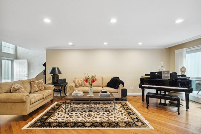 living room with crown molding and light wood-type flooring