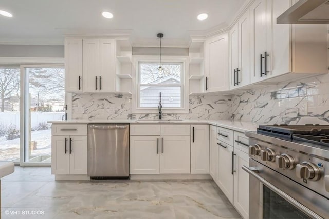 kitchen with sink, white cabinetry, decorative light fixtures, stainless steel appliances, and range hood