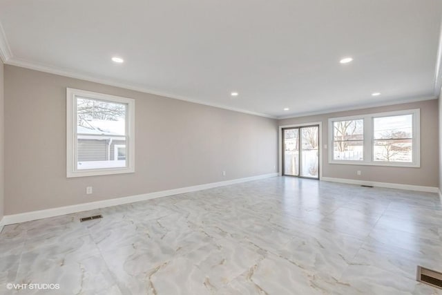 unfurnished room featuring crown molding