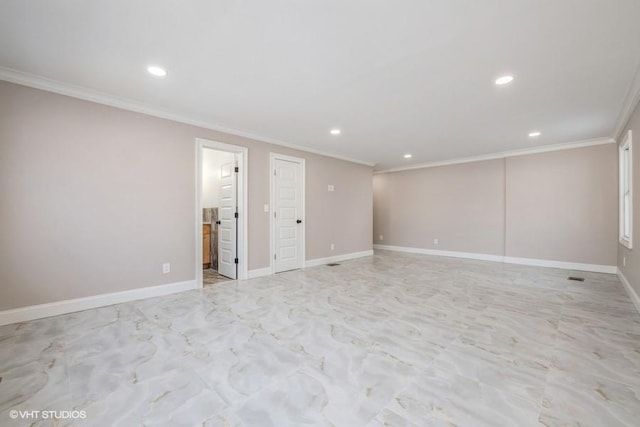 spare room with crown molding