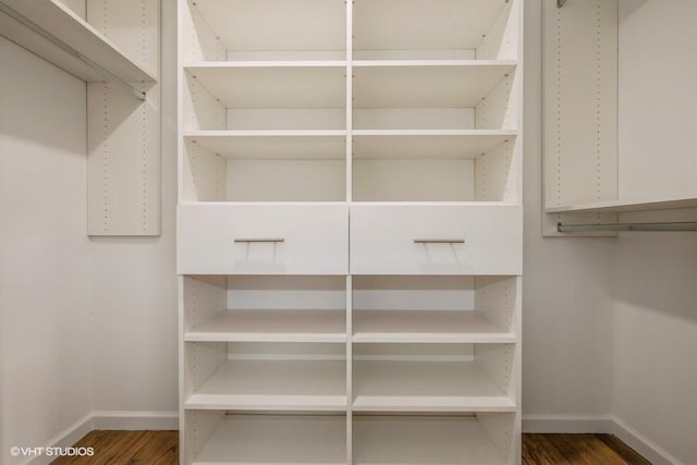 walk in closet featuring dark hardwood / wood-style floors