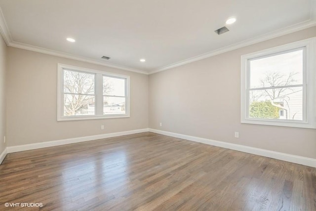 unfurnished room with ornamental molding and dark hardwood / wood-style flooring