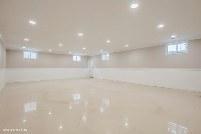 basement featuring light tile patterned floors and plenty of natural light