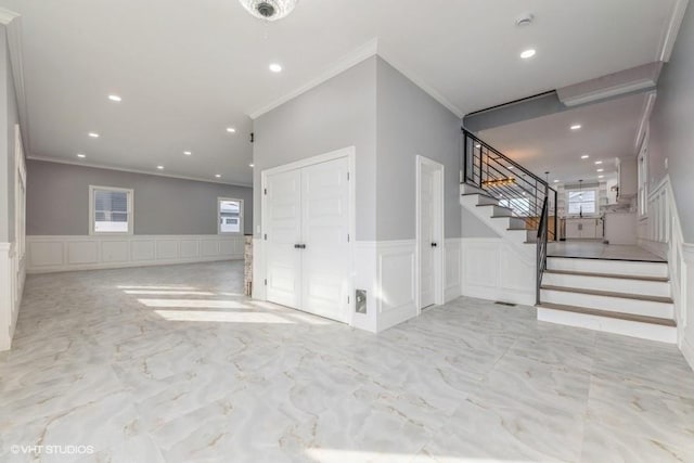 interior space with crown molding and plenty of natural light