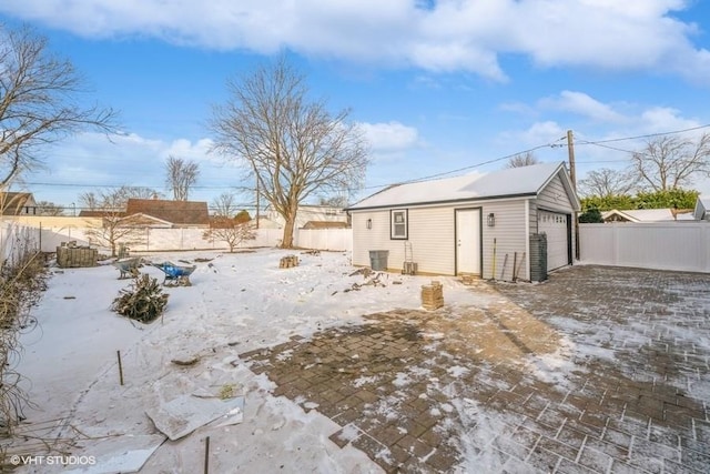 exterior space with a garage and an outdoor structure