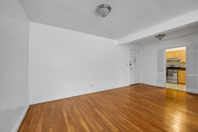 unfurnished living room featuring light wood-type flooring