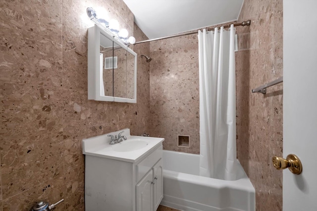 bathroom featuring shower / bath combination with curtain and vanity