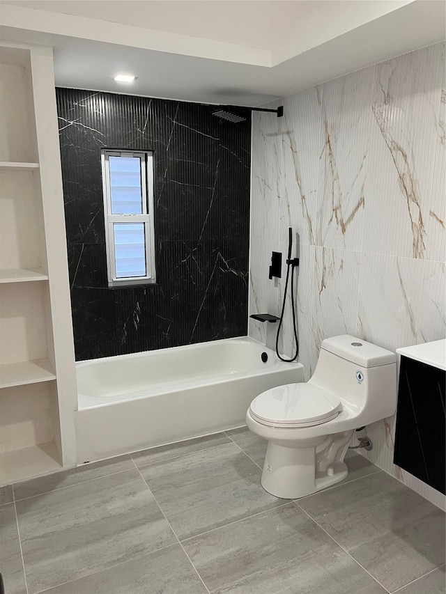 full bathroom featuring built in shelves, toilet, vanity, tiled shower / bath combo, and tile patterned flooring