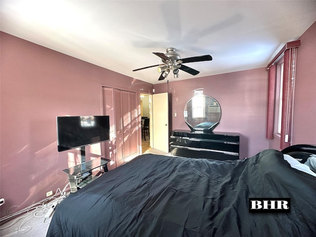 unfurnished bedroom featuring light colored carpet, ceiling fan, and a closet