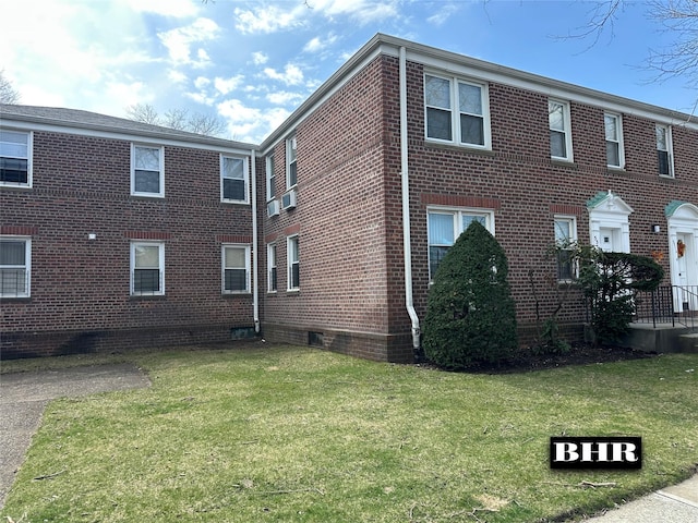 view of property exterior featuring a yard and brick siding