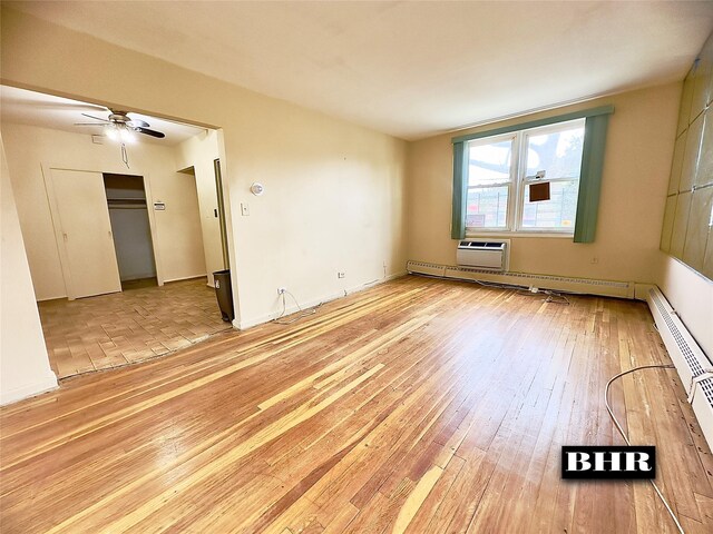 empty room featuring light wood-type flooring and ceiling fan